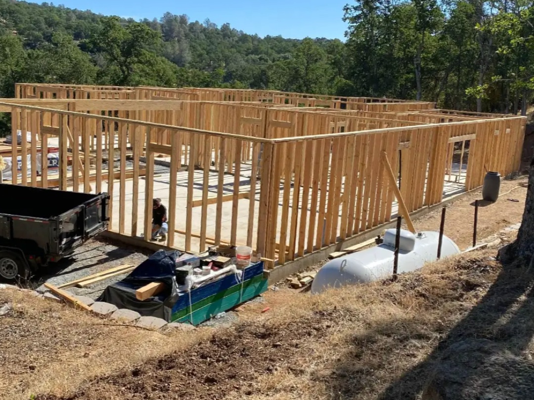 A Verceles Construction crew member at work inside the framed walls of a new home