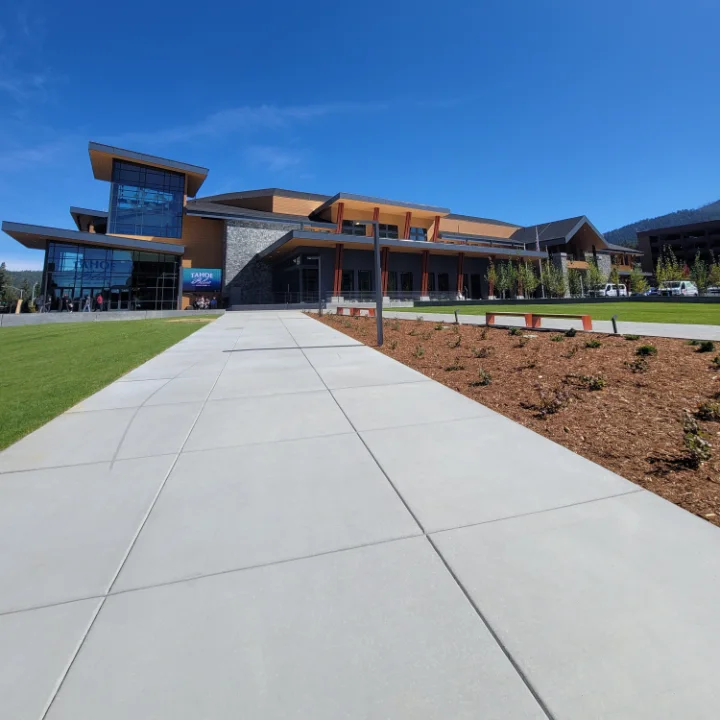 New concrete walkway leading to a completed public building