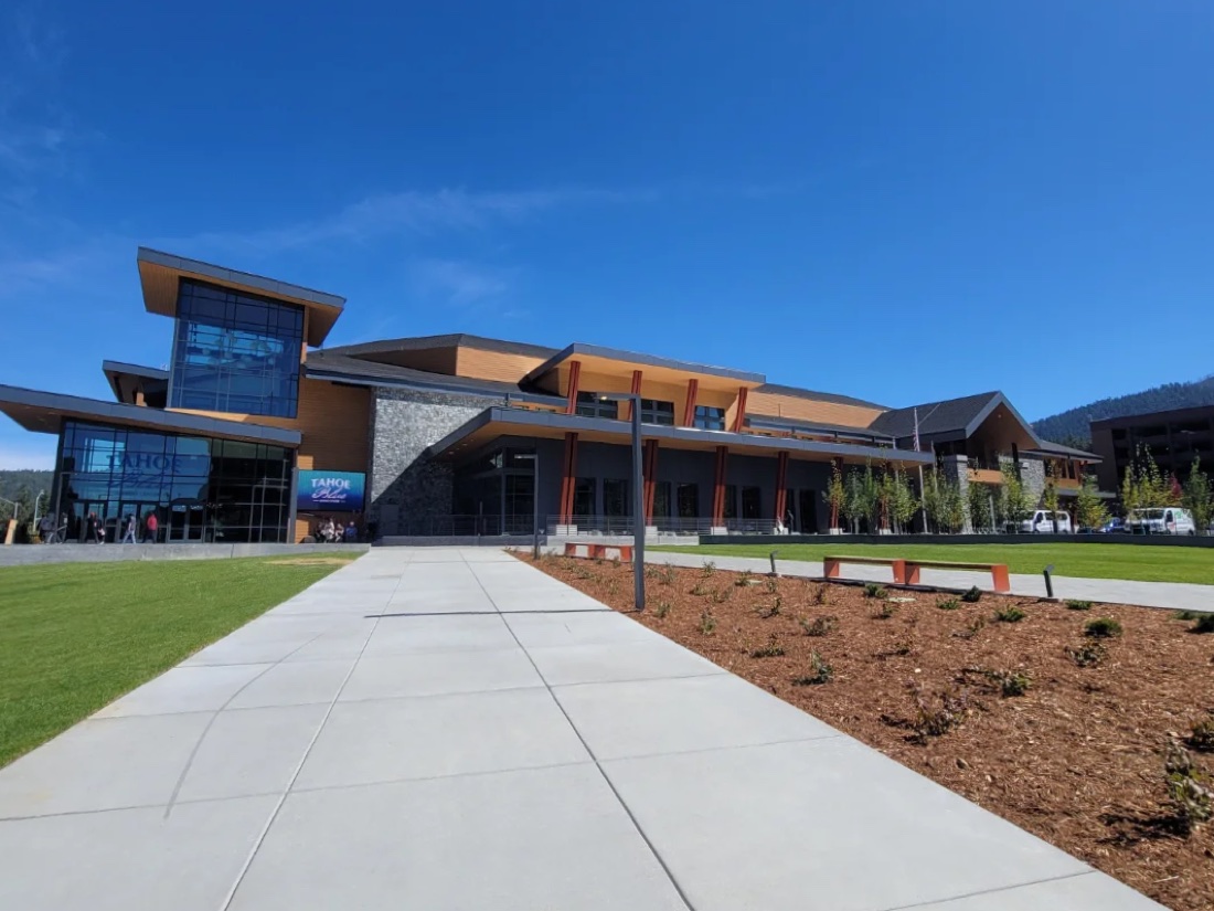 Completed public event center with new concrete walkway and landscaping
