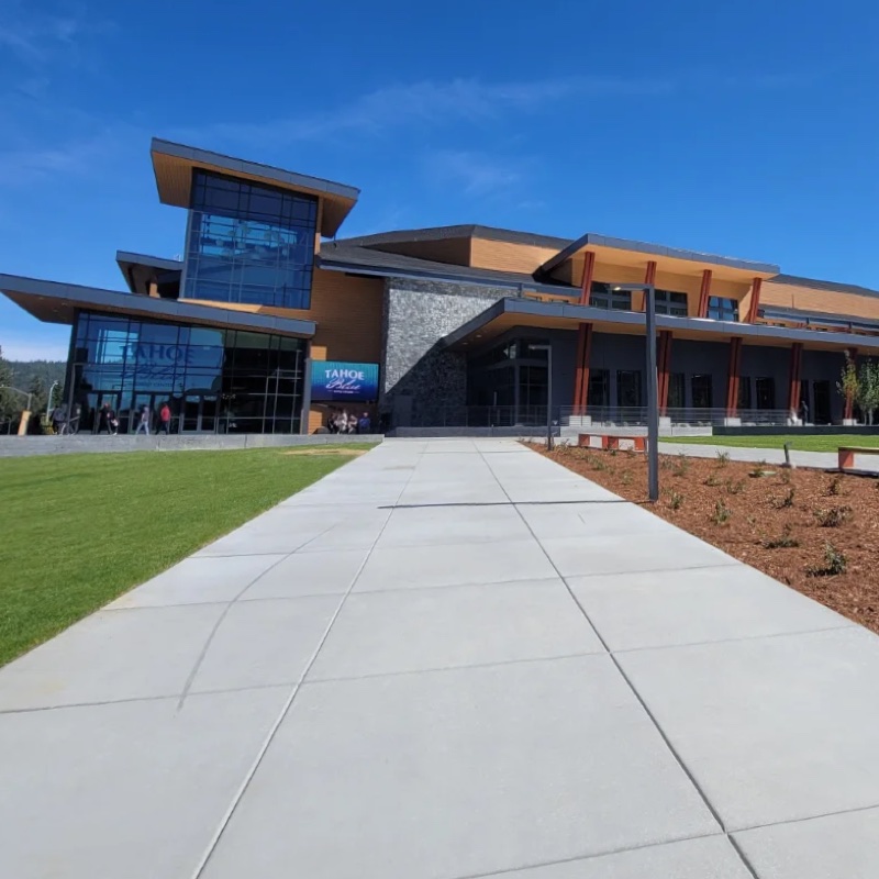 Completed public event center with new concrete walkway and landscaping